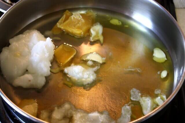 Step 1: Place solid oils (coconut, shea butter, cocoa butter) and Beeswax in a saucepan and gently warm over low heat