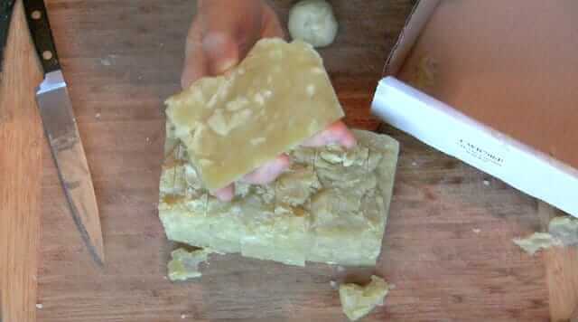 Step 10: Once the soap has had 24 hours to harden, remove from the mold and cut into bars.