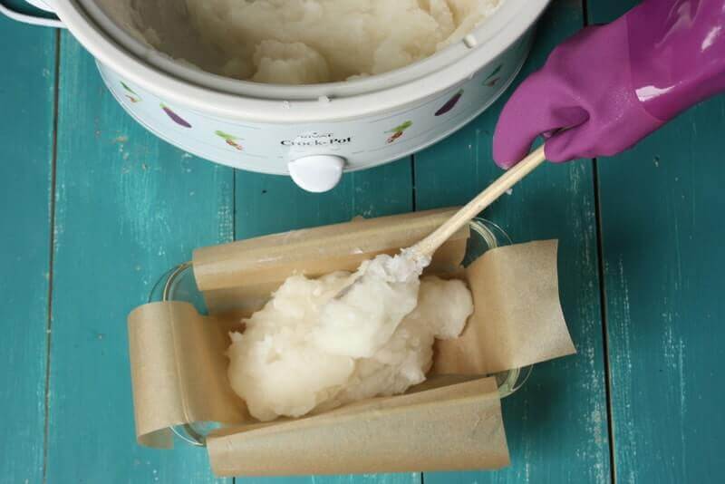 placing coconut oil soap in molds