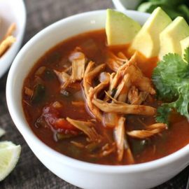 Chicken Tortilla Soup Recipe - poblano peppers, fresh cilantro, tangy lime and warm spices come together to make this belly warming soup a favorite in our house