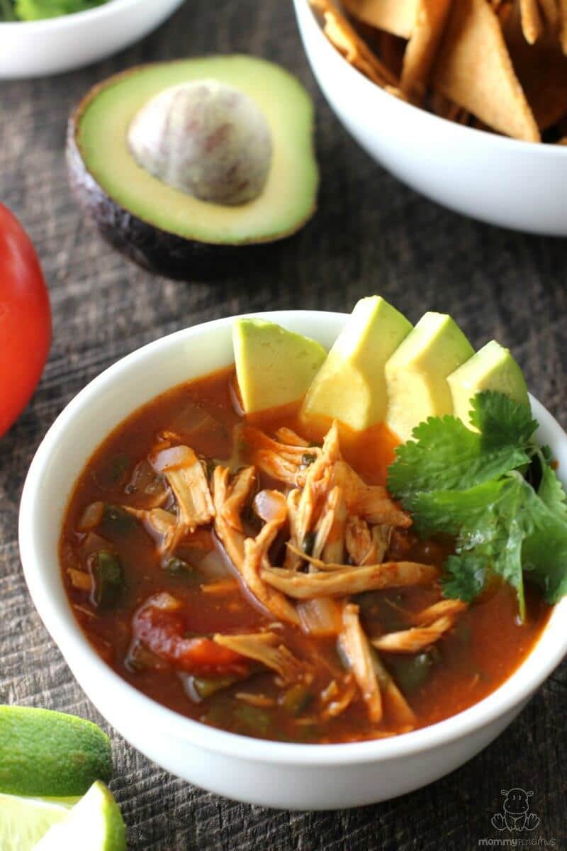 Chicken Tortilla Soup Recipe - poblano peppers, fresh cilantro, tangy lime and warm spices come together to make this belly warming soup a favorite in our house