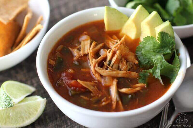 Chicken Tortilla Soup Recipe - poblano peppers, fresh cilantro, tangy lime and warm spices come together to make this belly warming soup a favorite in our house