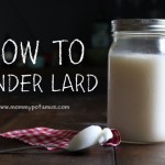 jar of rendered lard next to a spoon