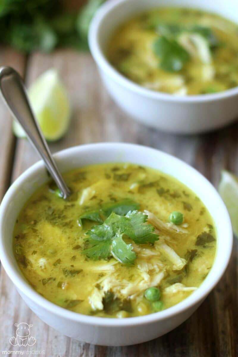 This simple Thai-inspired coconut lime chicken curry soup melds tangy lime and sweet coconut with warming ginger and fresh cilantro. It's one of my favorite ways to use leftover roasted chicken and homemade bone broth, and it's easy enough to make on a busy weeknight. #paleodinner #paleosoup #bonebroth #chickenbroth #turmeric