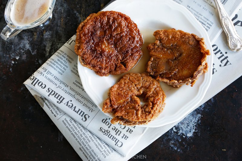 Three apple fritters on a place