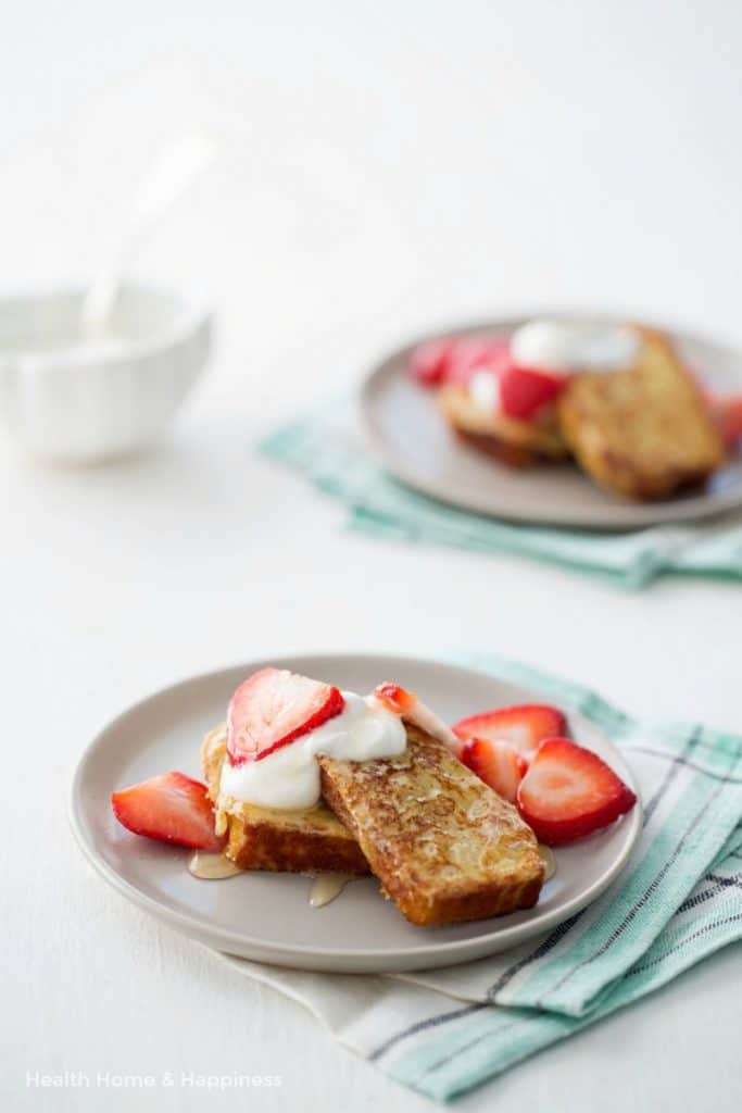 Made with day-old coconut flour bread, this gluten-free French toast recipe is a delightful morning treat! Top with strawberries, maple syrup, honey, toasted pecans, or whatever your family likes best.