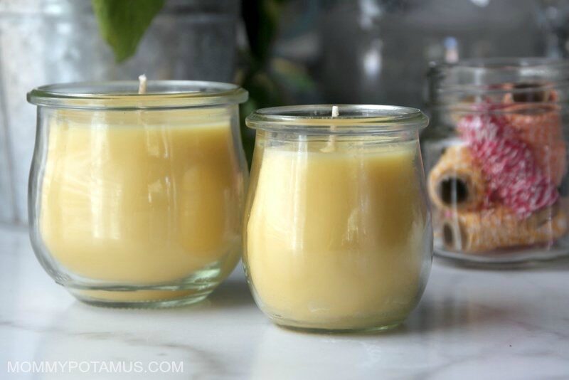 two homemade beeswax candles on a counter