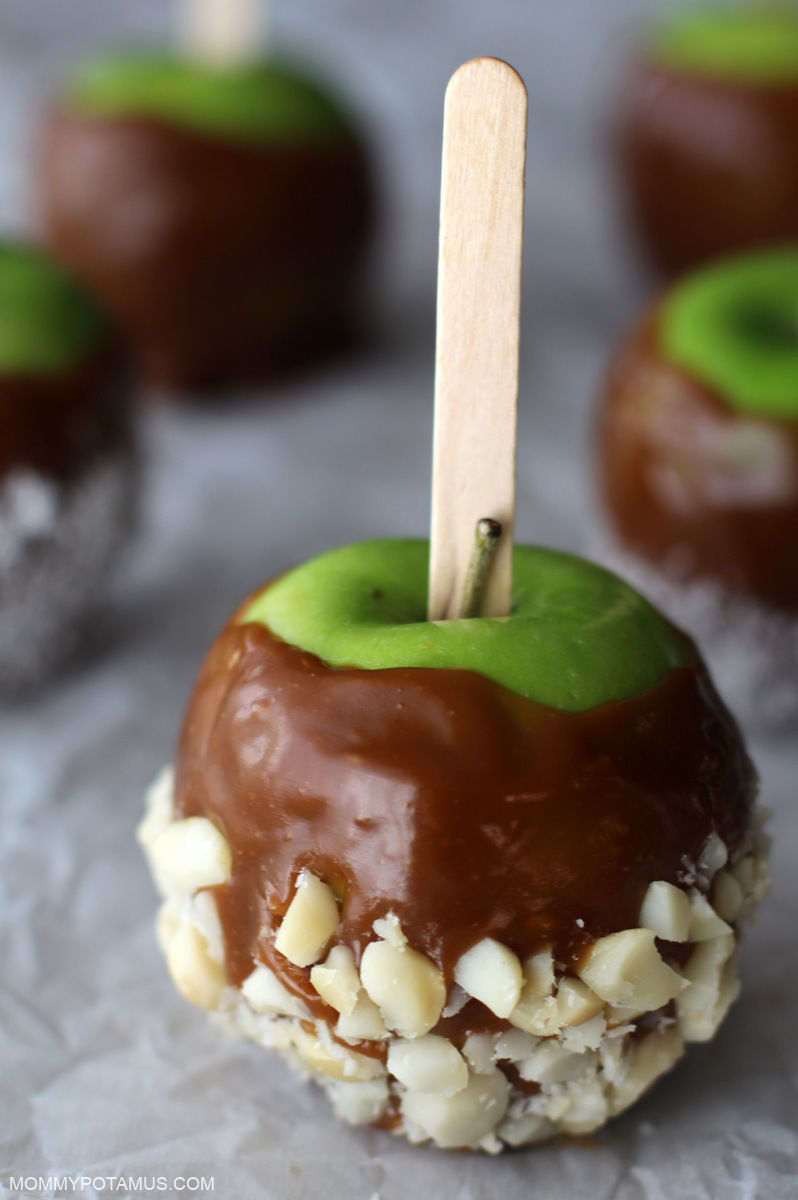 Up close view of caramel apple on parchment paper