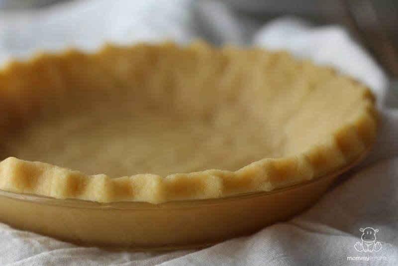 Unbaked almond flour pie crust on kitchen counter