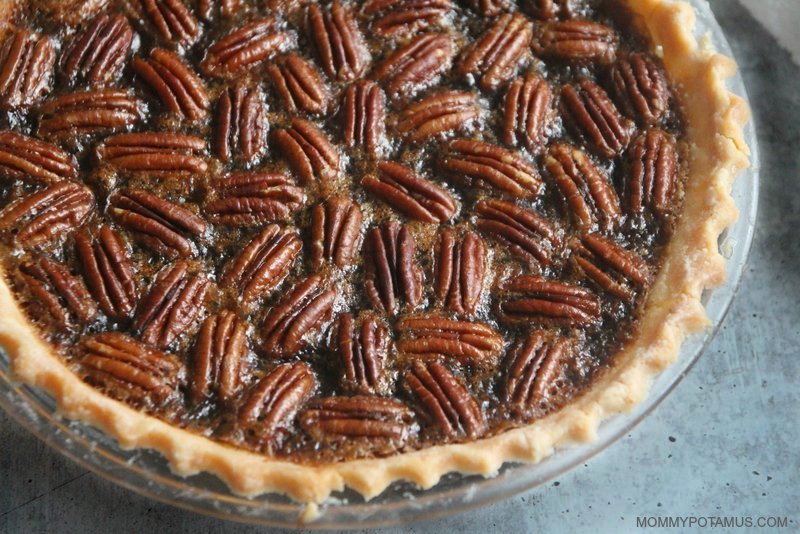 Maple pecan pie in glass dish on kitchen counter