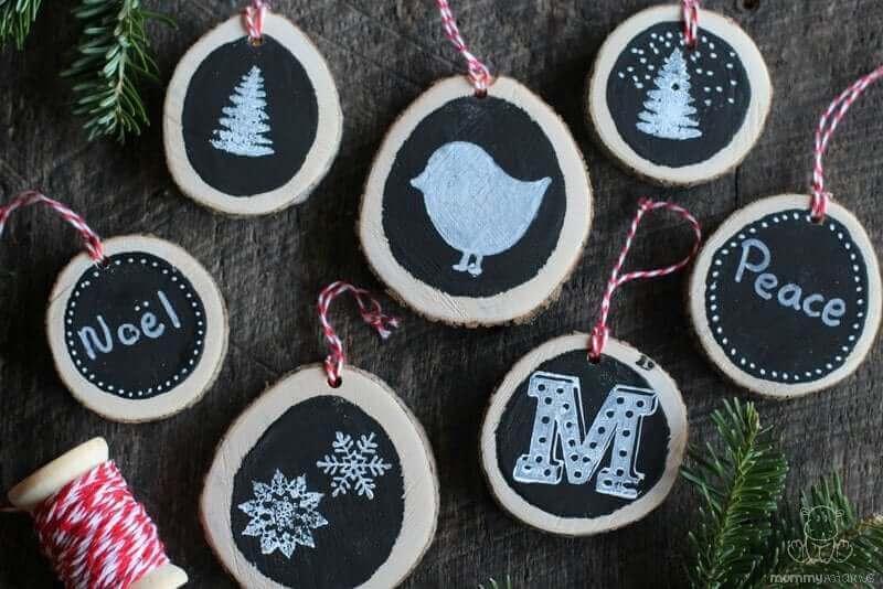 DIY chalkboard ornaments next to Christmas tree branches and twine