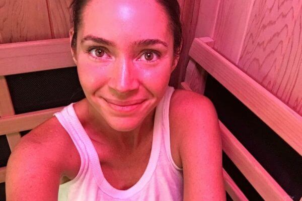 Heather sitting in sauna