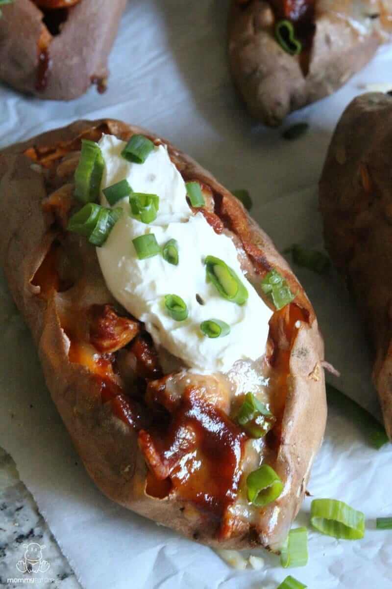 Load these Chipotle BBQ Chicken Stuffed Sweet Potatoes up with cheddar cheese, green onions, cilantro & a dollop of sour cream, or your favorite toppings. Banana peppers & minced red onions are delicious, too!