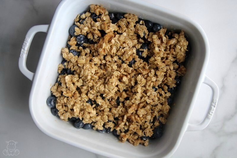 Blueberry crisp in baking dish, ready to go in the oven