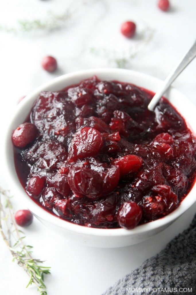 Close up of whole berry cranberry sauce on Thanksgiving table