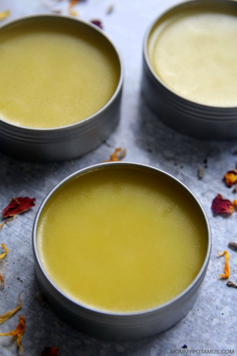 Overhead view of homemade hand salve in round metal tins