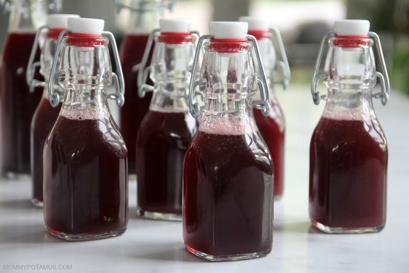 Bubbly elderberry soda in swing-top bottles