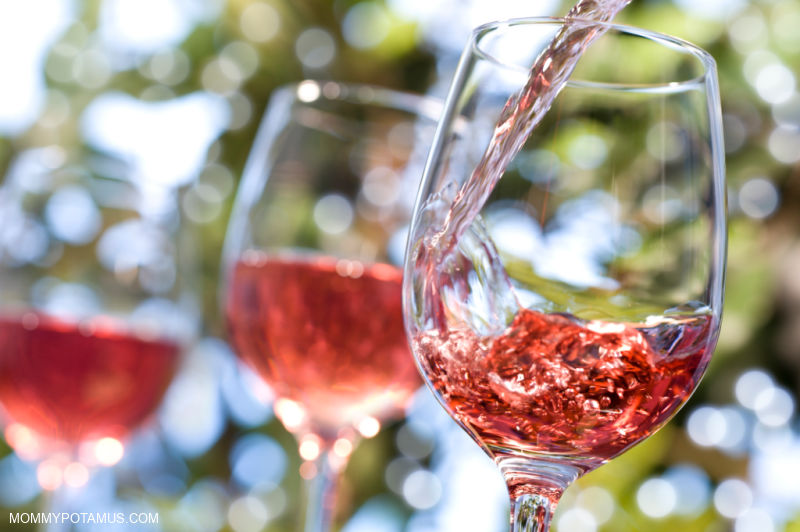 Pouring natural wine into glasses