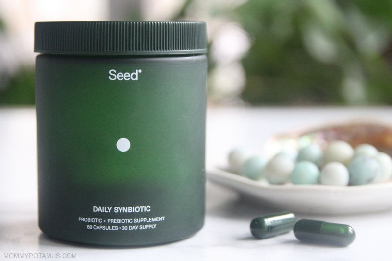 Seed probiotic jar with capsules next to it