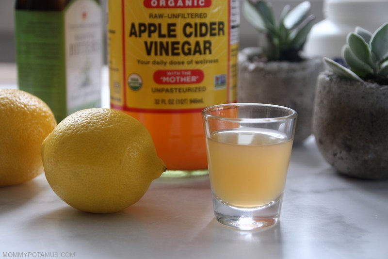 Glass on countertop containing apple cider vinegar, which is a tried-and-true home remedy for heartburn