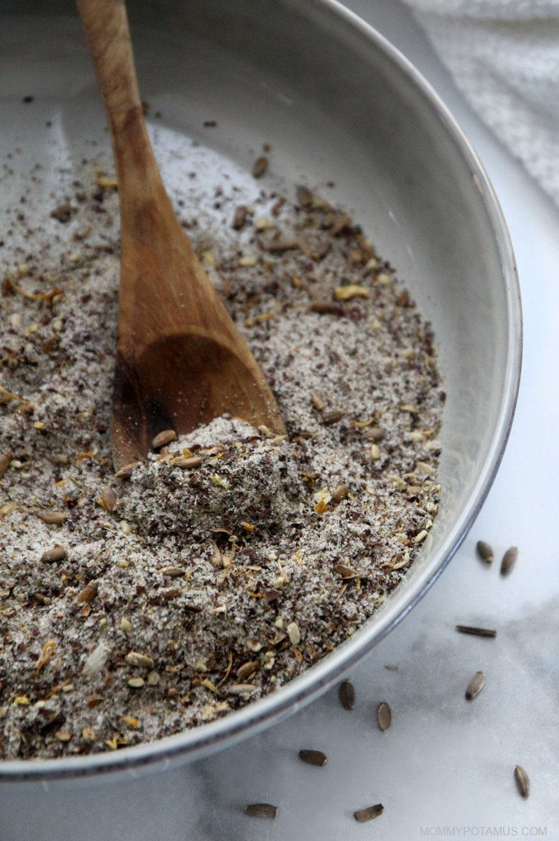 Overhead view of milk thistle seasoning salt in mixing bowl