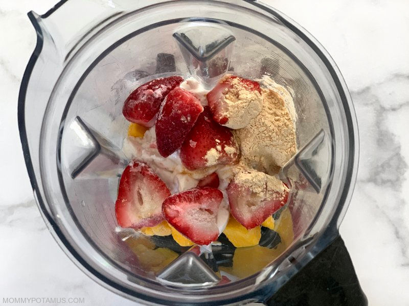 Baobab powder, strawberries, mangoes, and yogurt in blender