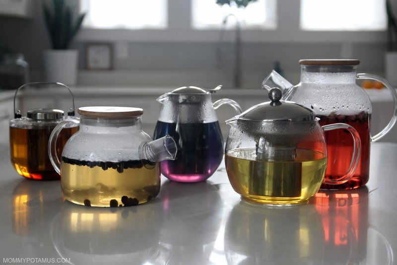 Collection of glass teapots on kitchen counter