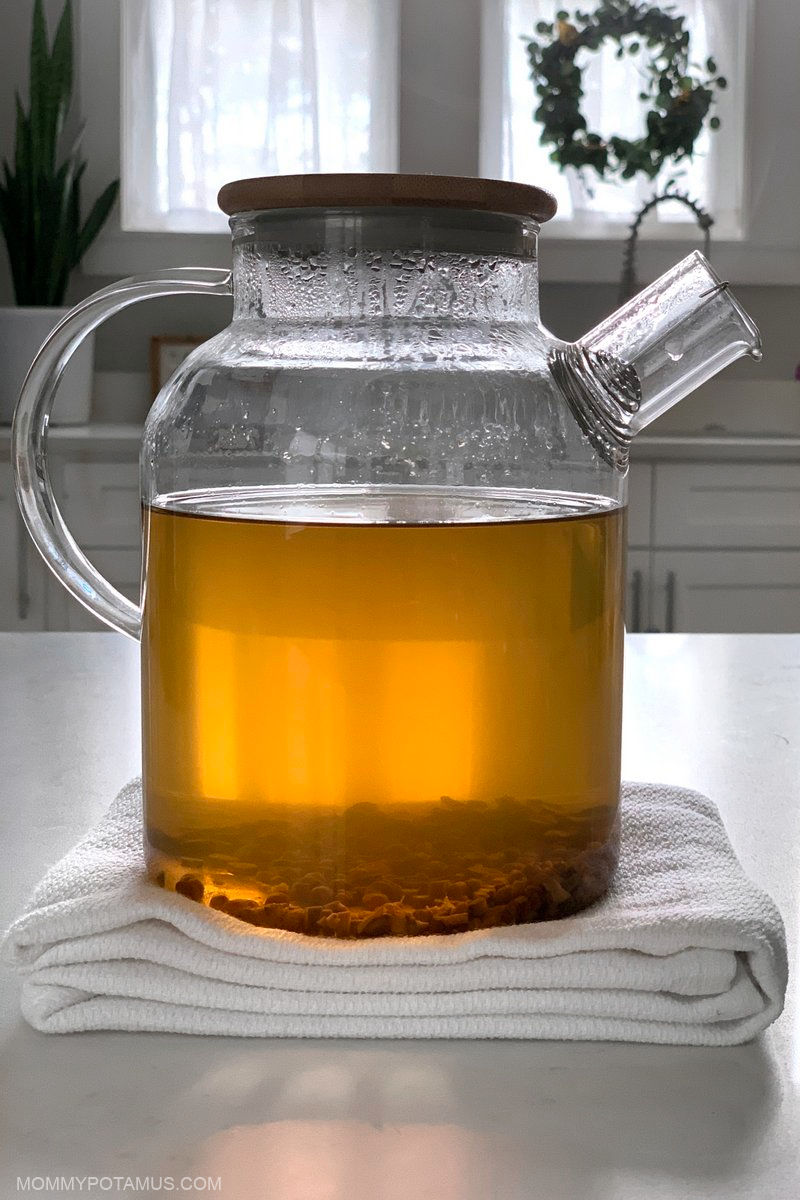 Glass teapot filled with astragalus tea