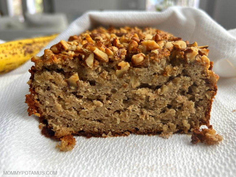 Sliced gluten-free banana bread on kitchen counter.