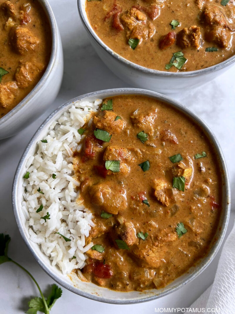 Overhead view of chicken tikka masala with basmati rice. 