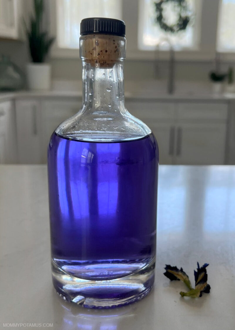 Witch hazel and butterfly pea flower toner on kitchen counter