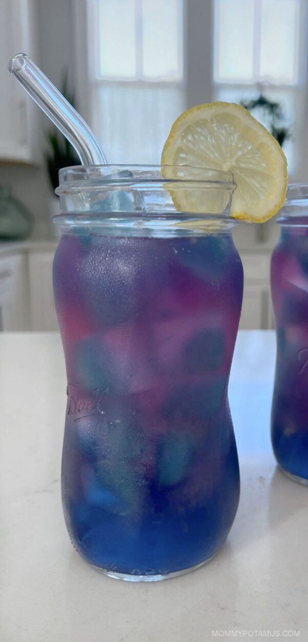 Up close view of one glass of butterfly pea flower lemonade