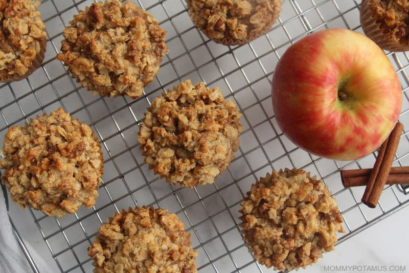 Overhead view of cinnamon apple muffins on cooling rack