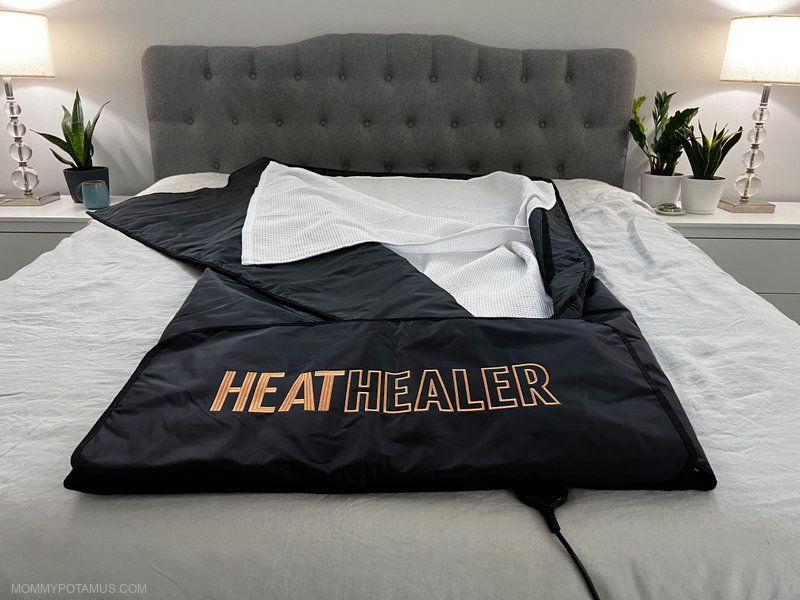 Infrared sauna blanket with cotton liner on bed
