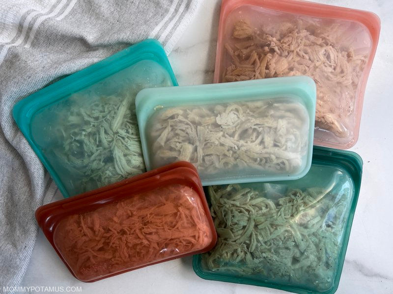 Silicone food storage bags full of shredded chicken