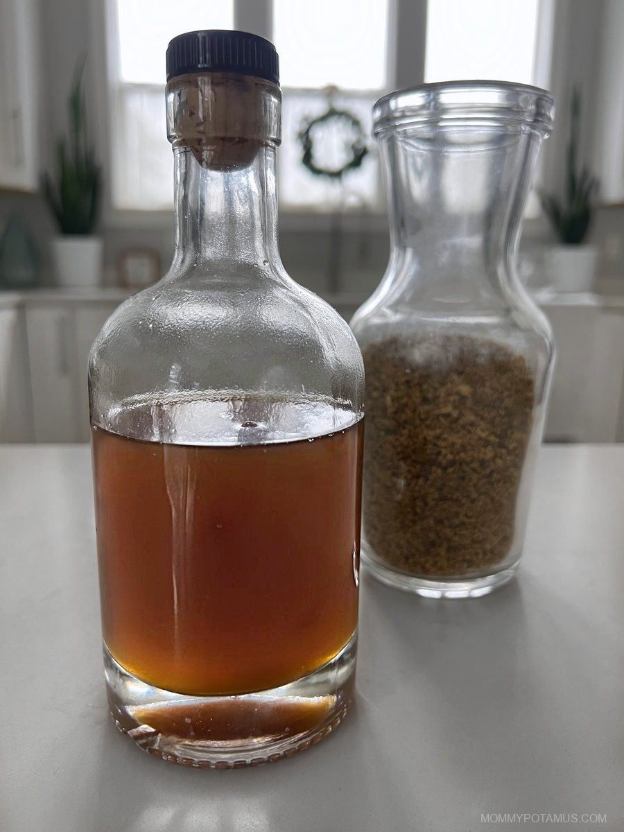 Up close view of elderflower soda in bottle. 