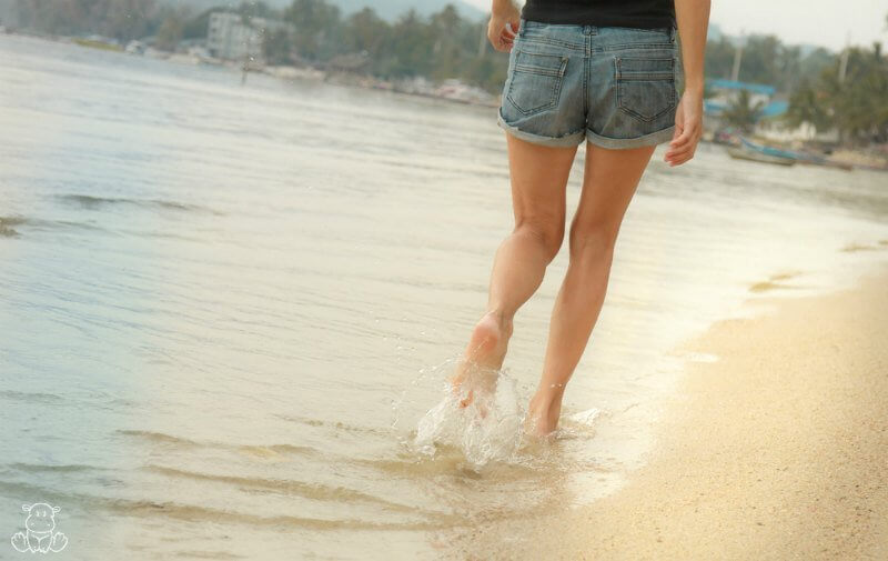 Woman walking on the beach