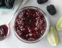 Jar of homemade blackberry jam with spoon