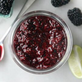 Jar of homemade blackberry jam with spoon