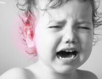 Child in pain with earache or ear infection