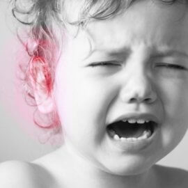 Child in pain with earache or ear infection