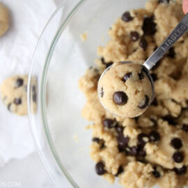 Scooping paleo chocolate chip cookie dough out of a bowl