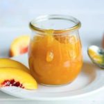 Peach freezer jam in a glass jar