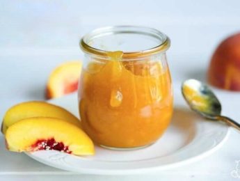 Peach freezer jam in a glass jar